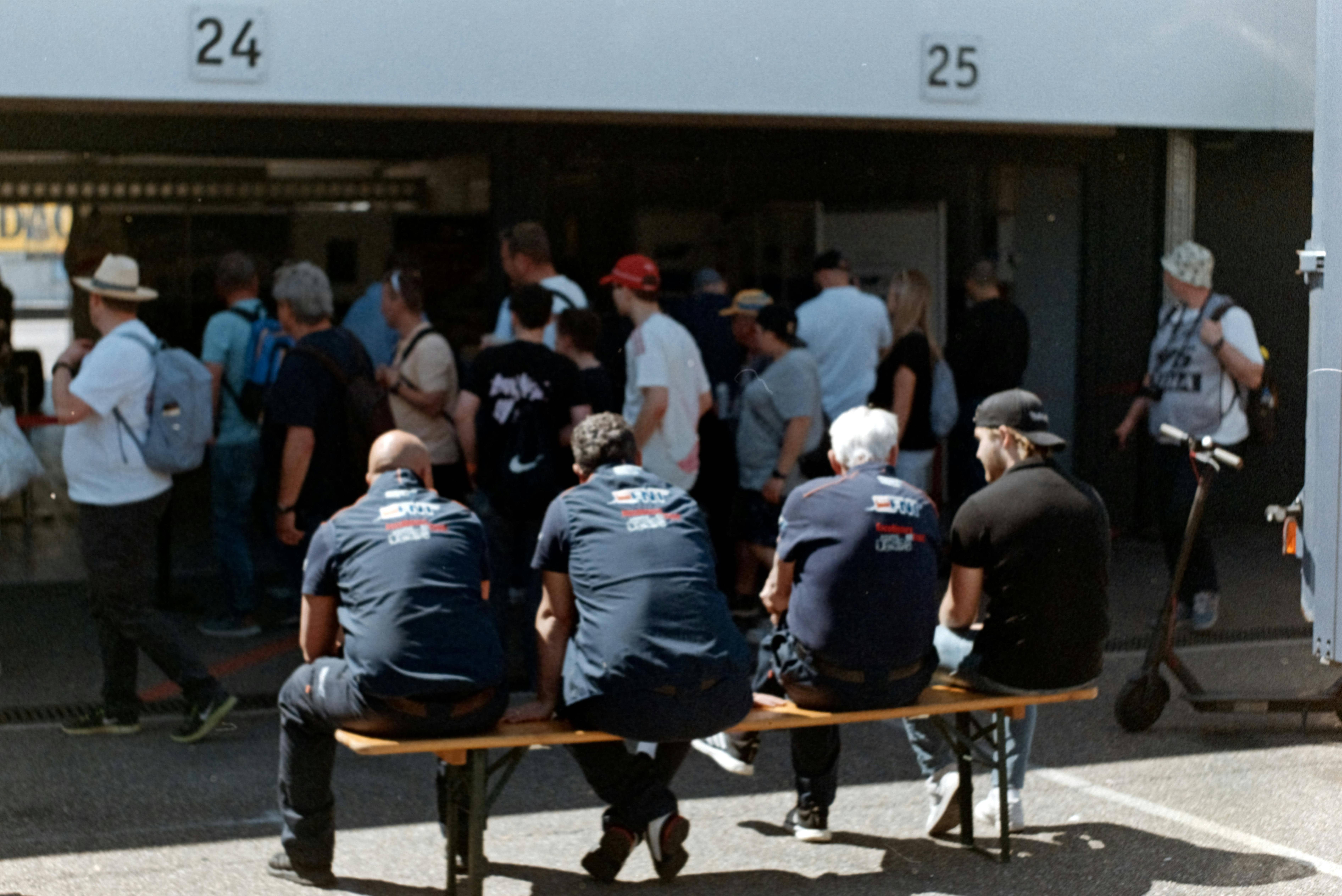 Crowd gathered at an event entrance on a sunny day, matching a World Cup 2026 last-minute tickets versus resale marketplace guide.